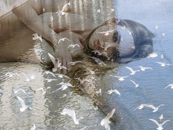Double exposure of girl lying in bed and seagulls — Stock Photo, Image