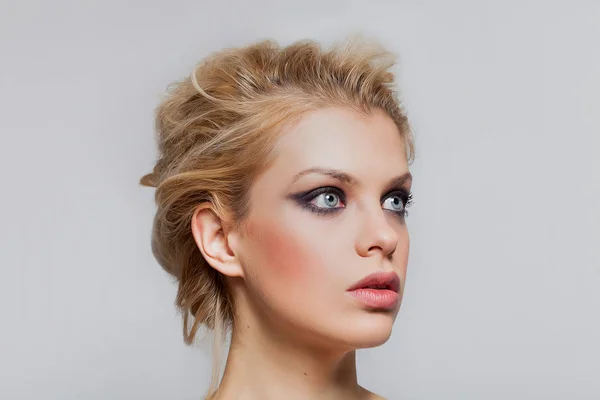 Beautiful blonde girl portrait with gorgeous blue eyes looking up — Stock Photo, Image