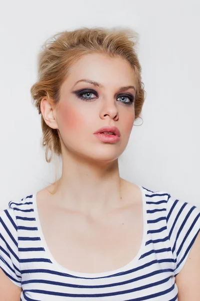 Pretty blonde girl portrait with smokey eyes wearing striped t-shirt — Stock Photo, Image