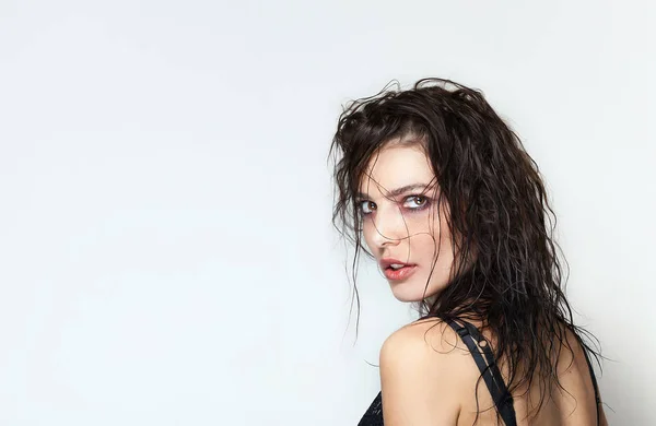 Beautiful woman back portrait with wet hair looking at camera — Stock Photo, Image