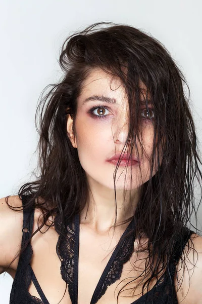Pretty woman with wet hair and smudged makeup — Stock Photo, Image