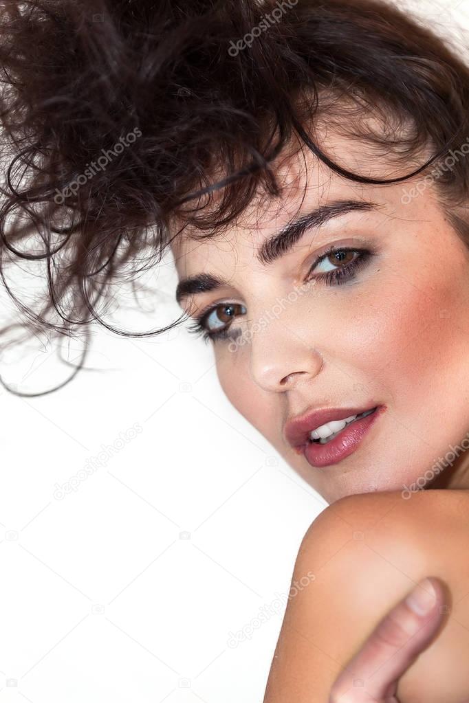 Beautiful woman closeup portrait with messy hair and smudged makeup