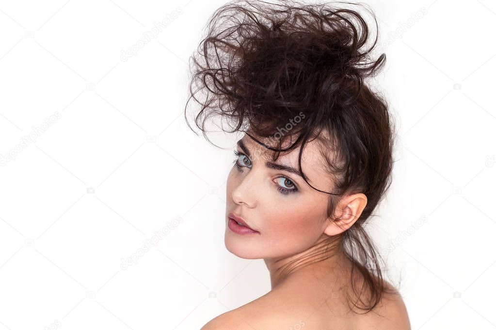 Pretty woman portrait with messy hair and smudged makeup looking back