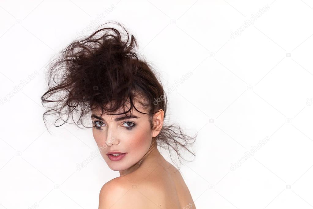 Woman portrait with messy hair and smudged makeup looking back