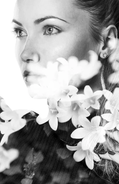 Monochrome double exposure of beautiful girl looking aside and flowers — Stock Photo, Image