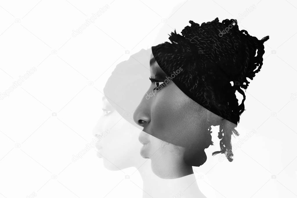 Monochrome double exposure of african woman profile portrait with braids