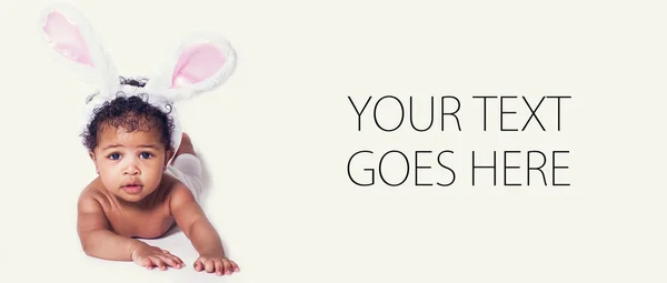 Cute baby girl portrait wearing bunny ears, card — Stock Photo, Image