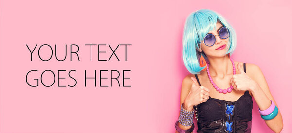 Funny girl portrait smiling and wearing wig with thumbs up, card