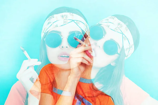 Double exposure of hippy girl portrait smoking weed while wearing sunglasses — Stock Photo, Image