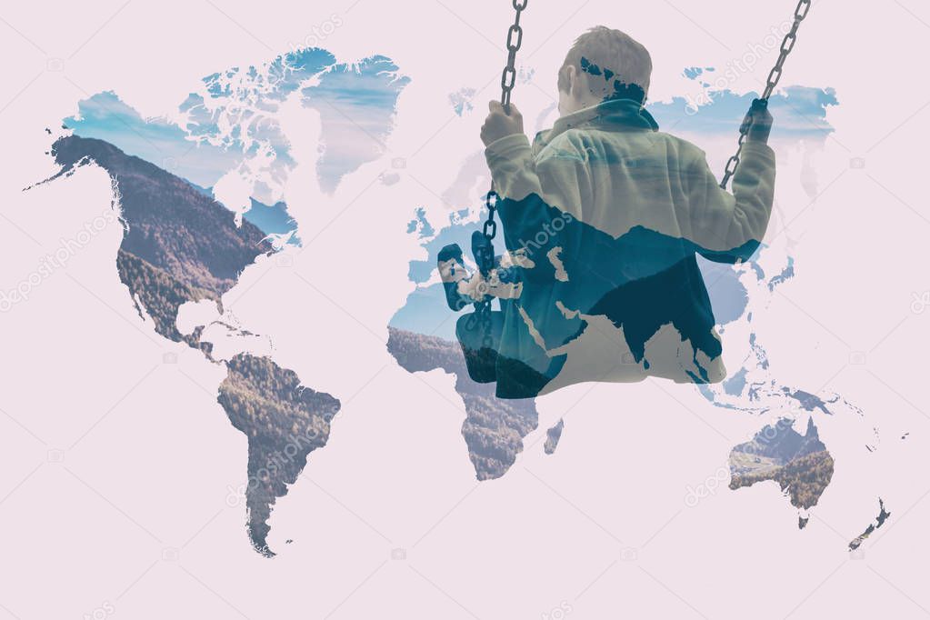 Multiple exposure of kid on swing and world map with autumn mountainscape