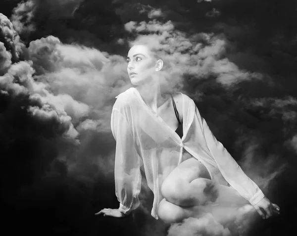 Monochrome double exposure of beautiful and thoughtful girl and stormy cloudscape — Stock Photo, Image