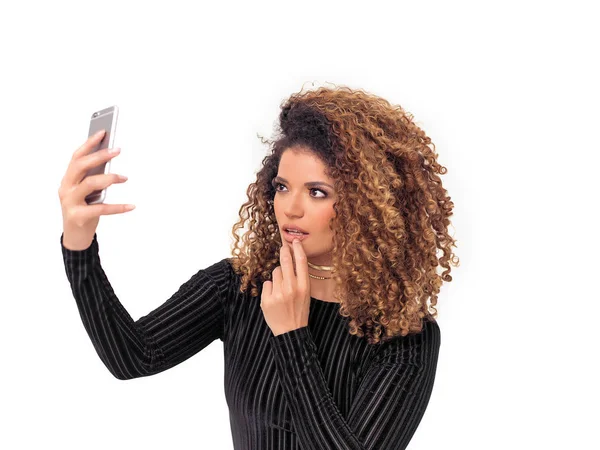 Beautiful woman portrait with gorgeous curly hair taking selfie — Stock Photo, Image