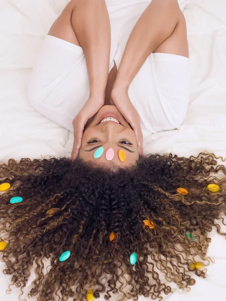 Lovely woman portrait with sugared almonds in her hair — Stock Photo, Image