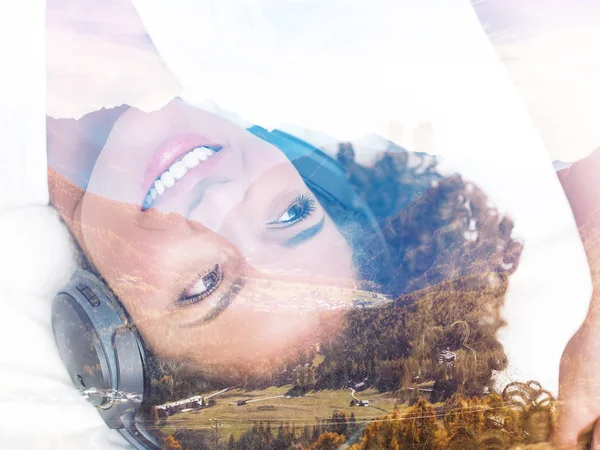 Double exposure of girl listening to music and relaxing autumnal mountainscape — Stock Photo, Image