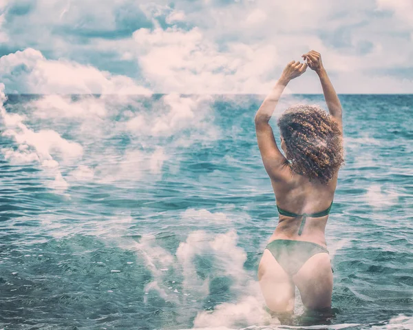 Double exposure of happy woman bathing in the sea and cloudscape — Stock Photo, Image
