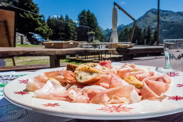 Typical Northern Italy plate with ham, mushrooms and potatoes — Stock Photo, Image