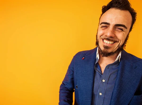 Happy man portrait smiling widely, yellow background — Stock Photo, Image