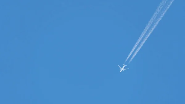Airplane trace on clean sky
