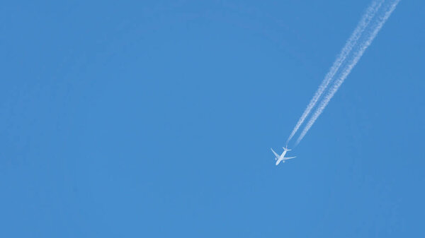 Airplane trace on clean sky