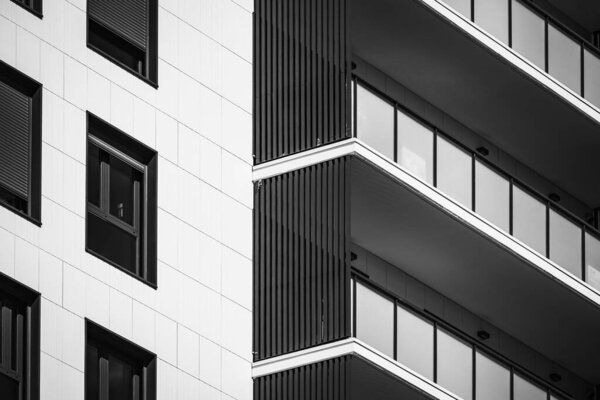 Detail of the facade of a residential building in black and white