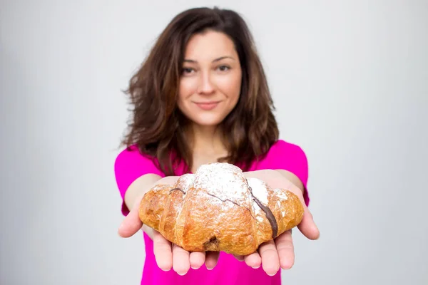 Fit woman in pink shirt  , young woman with apple. not isolated