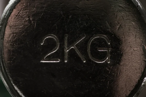 Black metallic dumbbell weighting 2 kg — Stock Photo, Image