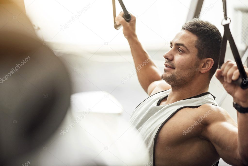 Good looking delighted man enjoying a workout