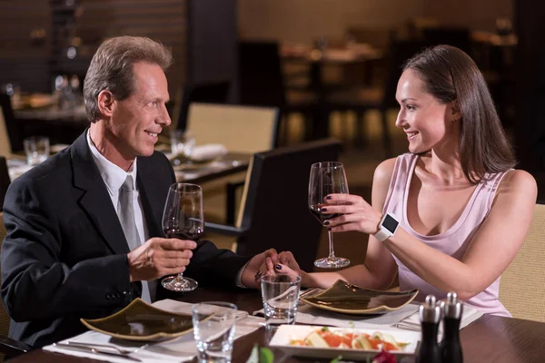 Delighted couple drinking wine in the restaurant — Stock Photo, Image