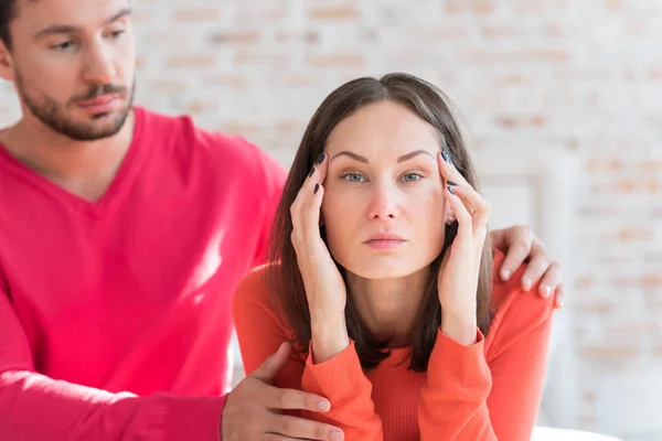 Depressed attractive woman pressing her hands to the head — Stock Photo, Image