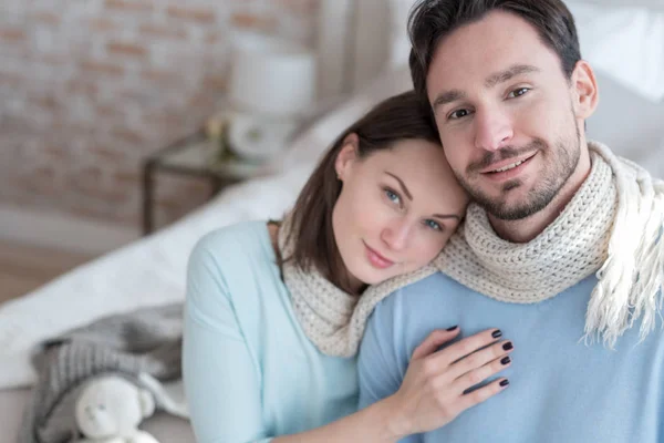 Happy delighted man sitting near his girlfriend — Stock Photo, Image