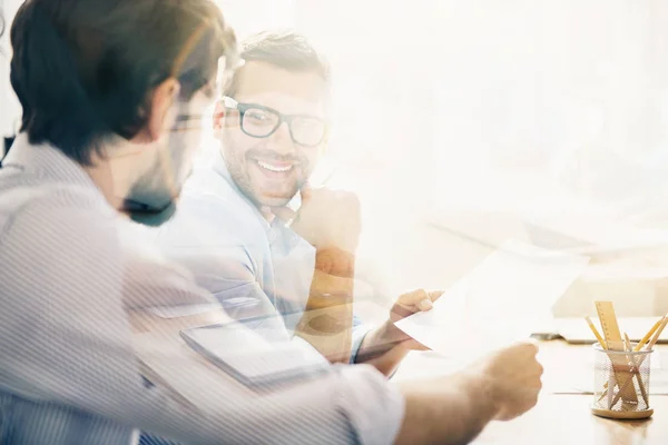 Smiling man during business meeting with his partner — Stock Photo, Image