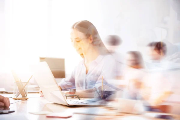 Double exposure of nice smiling girl working on laptop — Stock Photo, Image