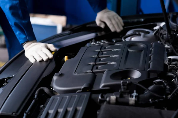 Professional mechanic checking car engine — Stock Photo, Image