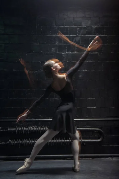 Skilled dancer performing on the dark background — Stock Photo, Image