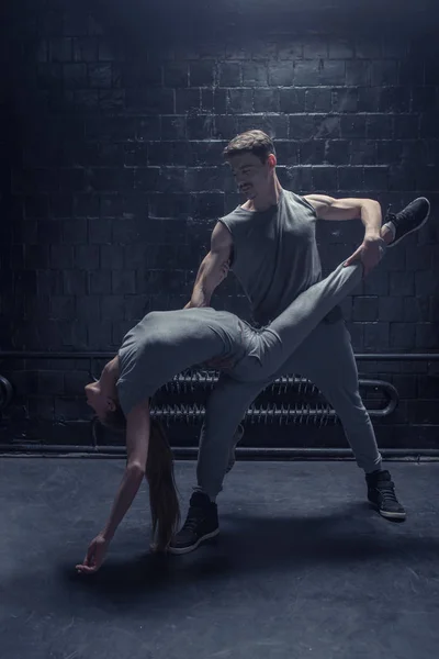 Delighted dancers performing in close interaction with each other — Stock Photo, Image