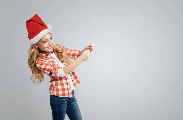 Positive girl holding flapper — Stock Photo, Image