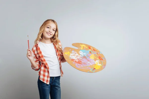 Positive creative little girl going to paint — Stock Photo, Image