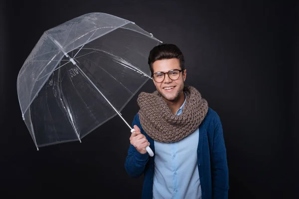 Pleasant handsome man holding umbrella — Stock Photo, Image