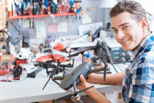 Joyful man holding drone propeller and remore controller — Stock Photo, Image