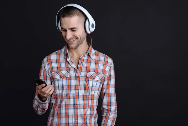 Attractive bearded man holding phone — Stock Photo, Image