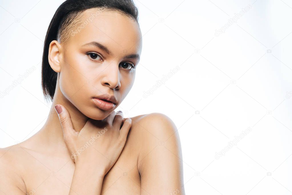 Beautiful young Negroid woman touching herself in the studio