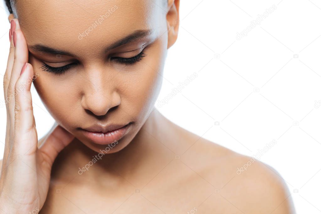 Upset young Negroid woman expressing emotions in the studio