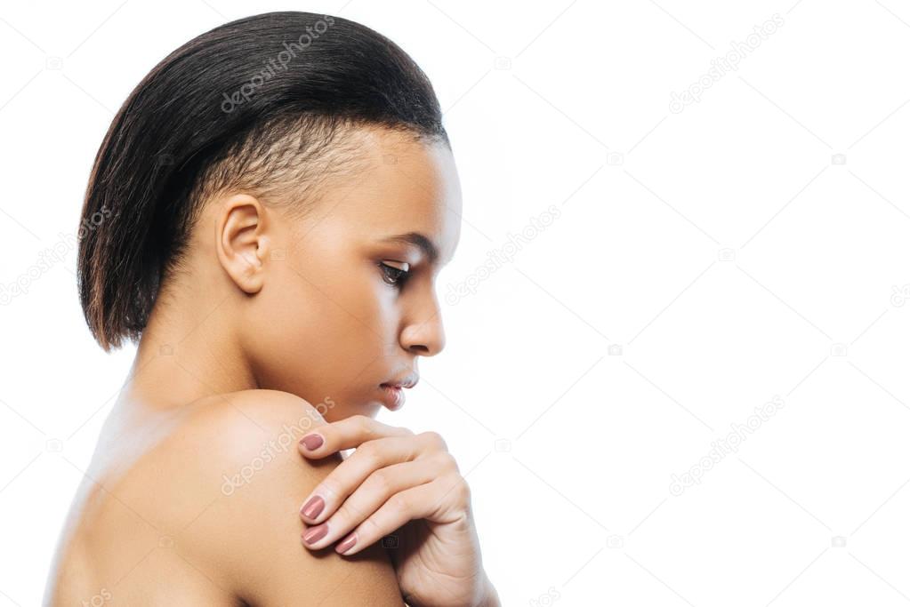 Peaceful young Negroid woman expressing her feelings in the studio