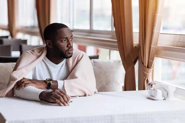 Charming African American man sitting in the cafe — Stock Photo, Image