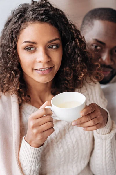 Pleasant African American couple drinking tea in the cafe — Stock Photo, Image