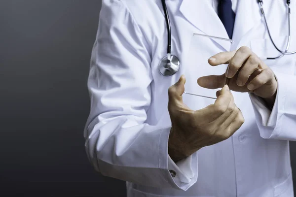 Close up of smart doctors hands holding special glass equipment — Stock Photo, Image