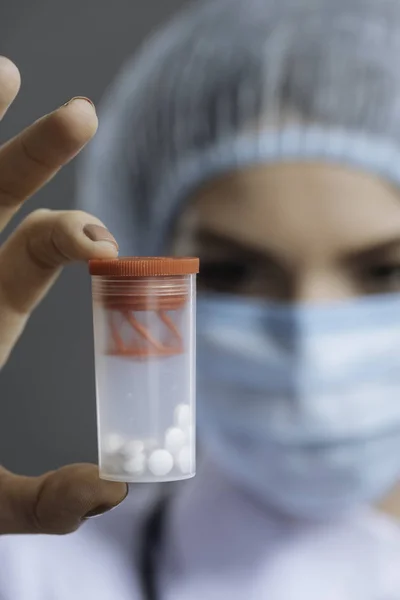 Close up of female doctor holding a pill box — Stock Photo, Image