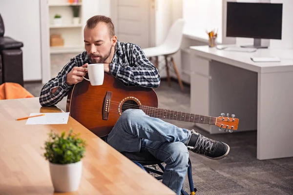 Devoted handicapped man rereading what he wrote — Stock Photo, Image