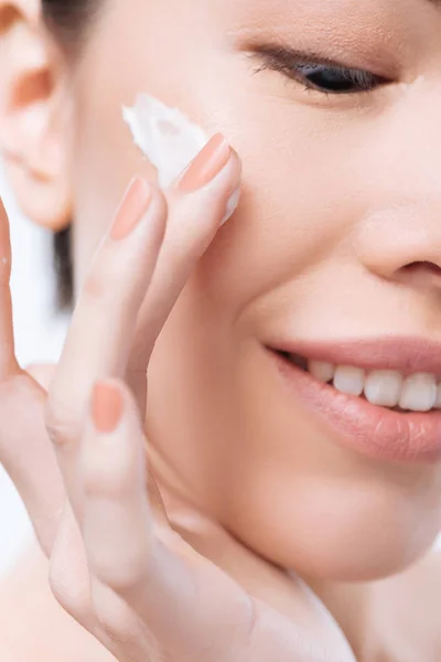 Close up of facial cream being applied on the cheek — Stock Photo, Image