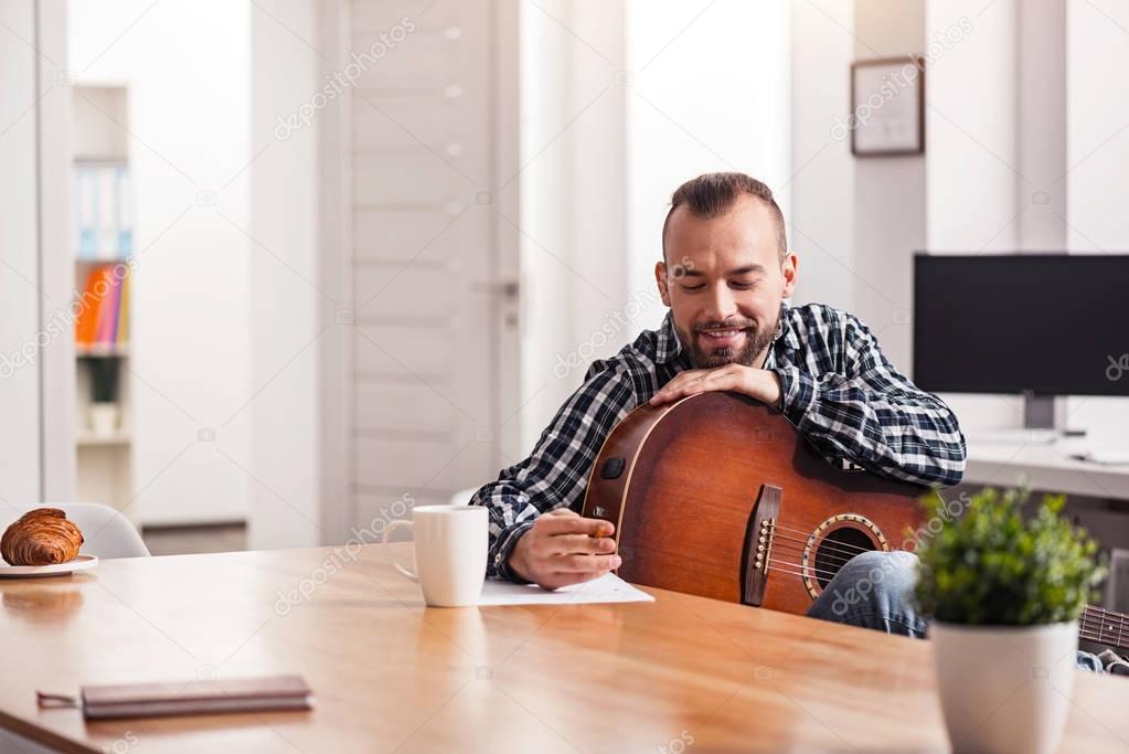 Enthusiastic young musician capturing his new song